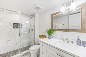 Shower, hair dryer, towels, soap