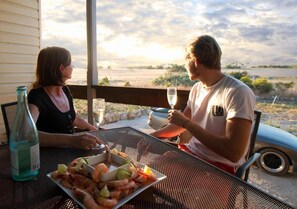 Enjoy a meal for two with a serene view of the surrounding landscape.