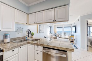 Fridge, microwave, oven, stovetop - Gulf-front condo with Gulf-view balcony, on-site pool, & beach access (Navarre Beach)