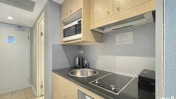 Fridge, microwave, cookware/dishes/utensils