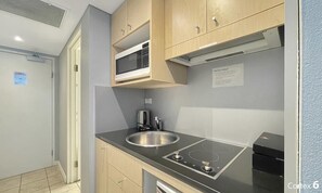 Fridge, microwave, cookware/dishes/utensils