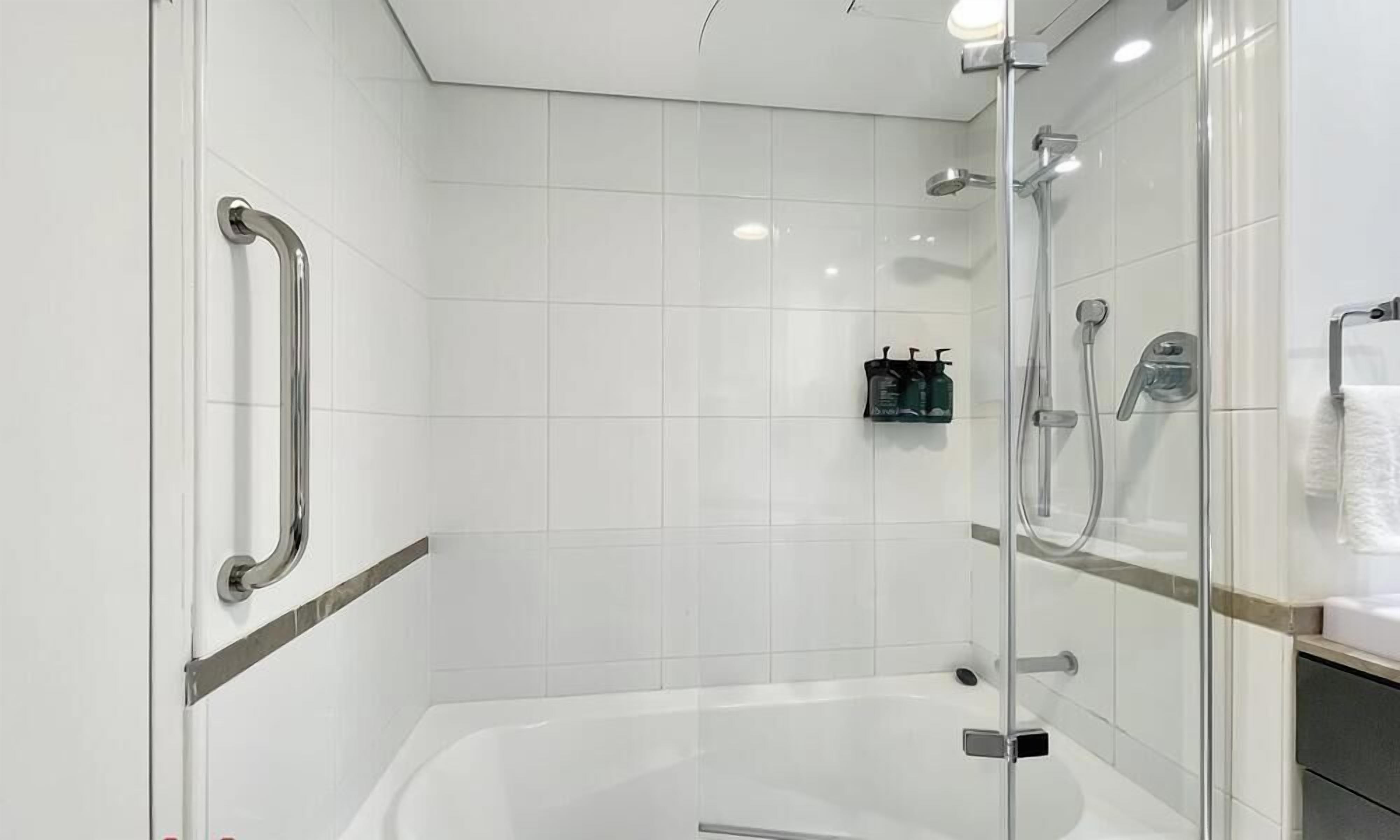 Shower, hair dryer, towels, shampoo