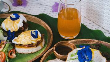 A table with food items and a glass of tea.