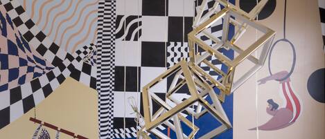 A geometric pattern on a wall with various shapes and lines.