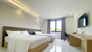 A modern hotel room with two beds, a desk, and a TV. - The Luxe Hotel - Chau Doc (Chau Doc)
