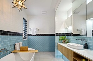 Shower, hair dryer, towels, shampoo
