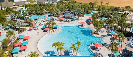 Splash, slide, and swim in this vibrant resort pool featuring a water slide, splash zone, and plenty of shaded seating for parents to unwind.