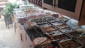 A buffet setup with various food items and condiments. - Gönül sefası bütik otel  (Amasya)