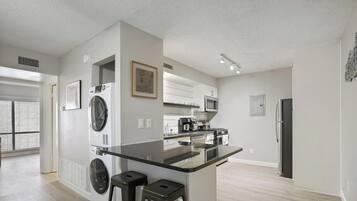 Coffee/tea maker, fridge, microwave, oven