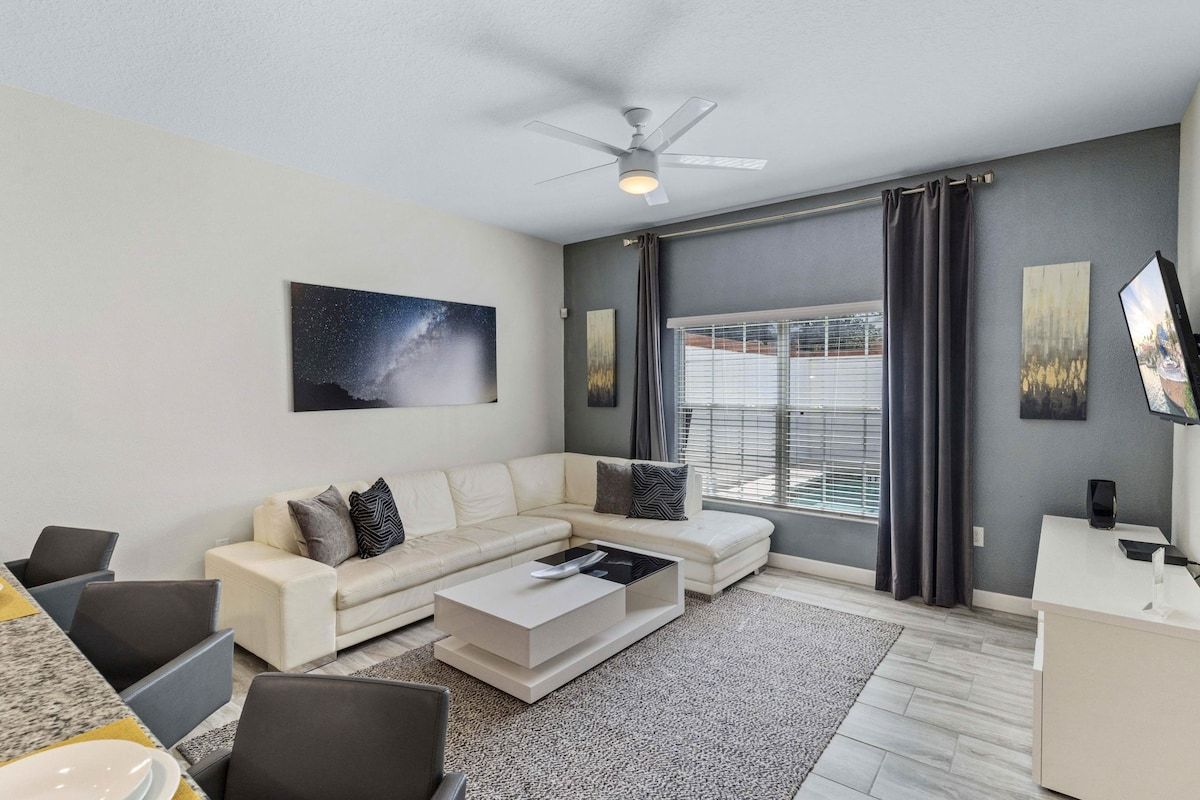 The Living area exude modernity, sophistication, and versatility.  I t has Sheer curtains  and  blinds that allows sunlight to filter through while maintaining privacy and controlling glare.