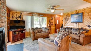 House (2 Bedrooms) | Living area | Fireplace, books