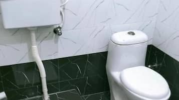 Deluxe Double Room | Bathroom | Shower, designer toiletries, slippers, towels