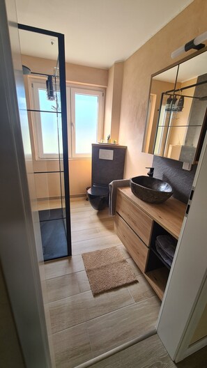 Shower, hair dryer, towels, soap