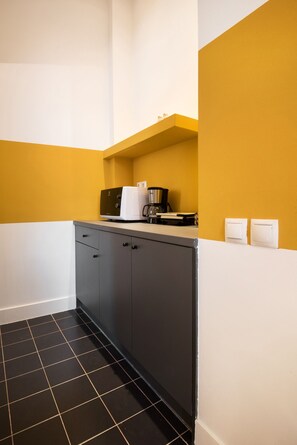 Mini-fridge, microwave, cookware/dishes/utensils