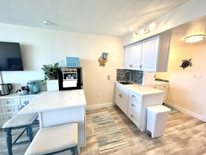 Fridge, microwave, stovetop, coffee/tea maker