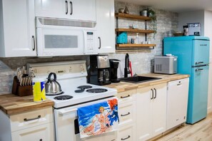 Microwave, stovetop, dishwasher, dining tables