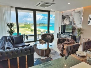 704: Grand Apartment, 1 Queen Bed, Balcony, Sea View | Living area | 55-inch Smart TV with satellite channels, Netflix, Hulu - Mullet Bay Suites: Your Luxury Stay Awaits (Lowlands)