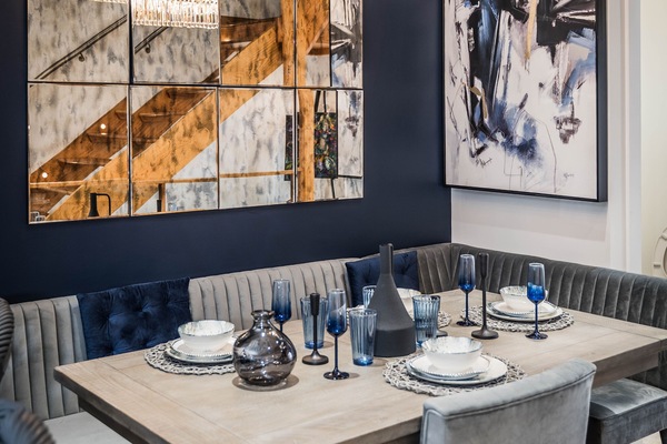 Enjoy breakfast, lunch or dinner in the cozy dining area with bench seating..