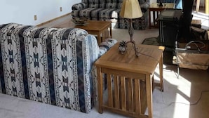 A spacious living room with a high ceiling, a wooden balcony, a mounted moose head, and a large window providing natural light. - Cozy Lakeview Cabin outside Jackson Hole
Pallisades Reservoir (Irwin)