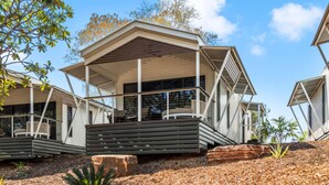 A modern, two-story house with a covered porch and a deck. - Discovery Parks - Broome (Broome)