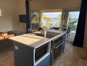 Fridge, microwave, oven, stovetop - Private Waterfront Estate for 16- Two Apartments & One house. (Green turtle cay)