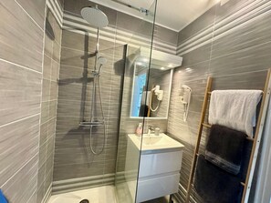 Shower, hair dryer, towels, soap