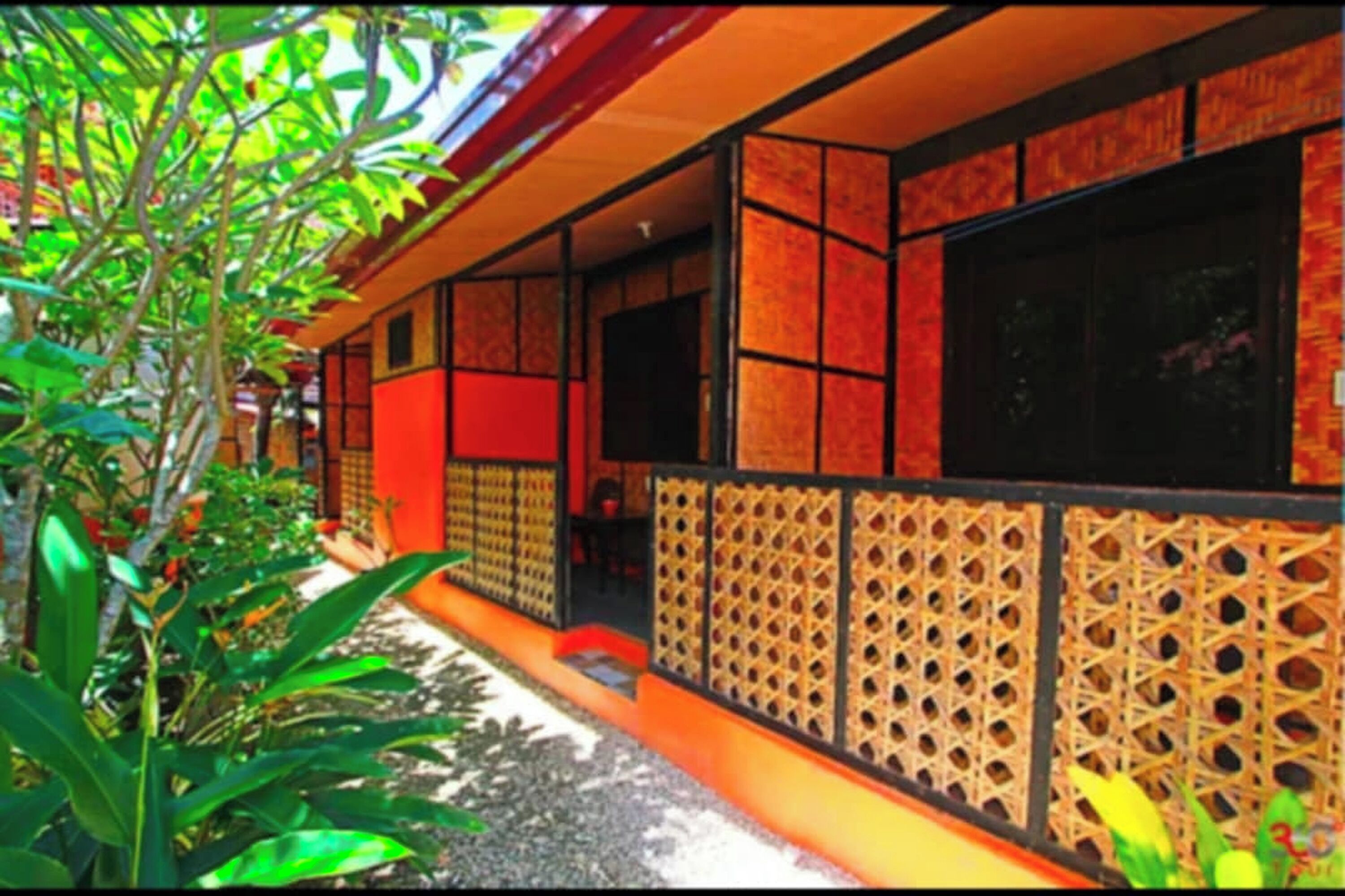 A traditional building with a tiled exterior and a wooden lattice wall.
