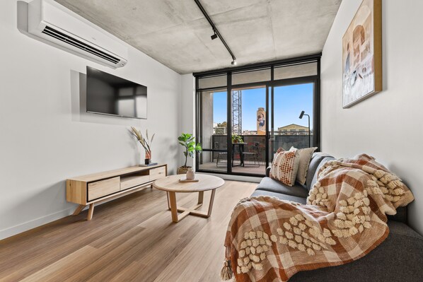 1 Bedroom Apartment | Living area | 42-inch plasma TV with digital channels