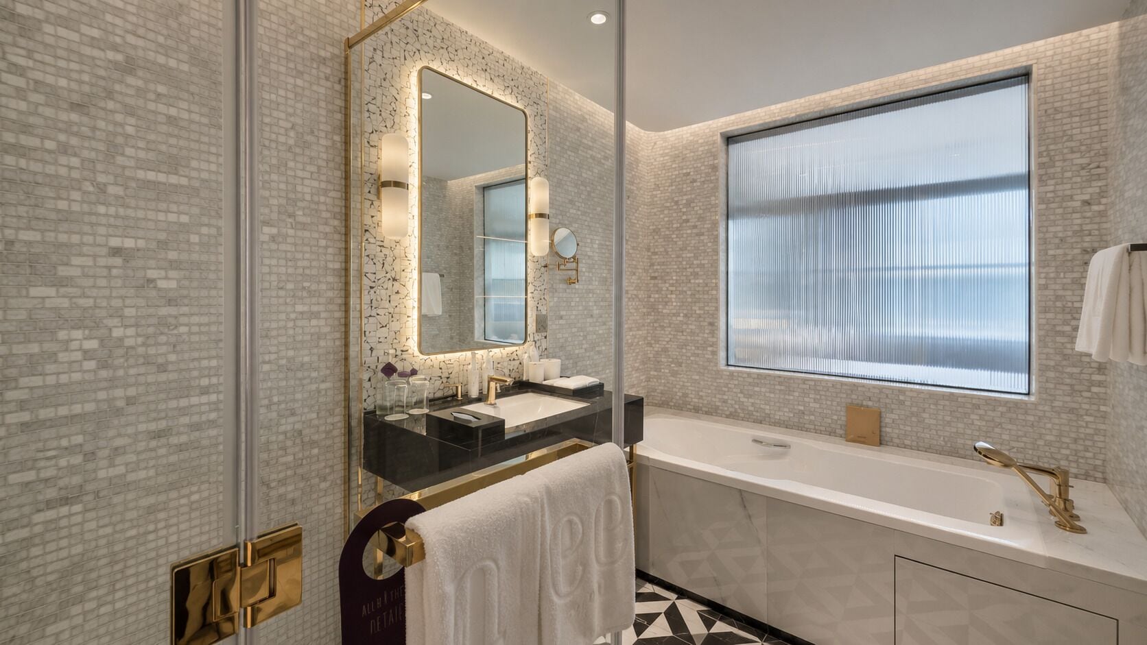 Separate tub and shower, rainfall showerhead, free toiletries