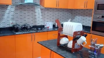 Fridge, microwave, electric kettle, cookware/dishes/utensils