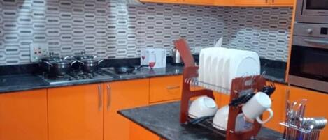 Fridge, microwave, electric kettle, cookware/dishes/utensils