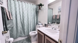 Hair dryer, towels, soap, shampoo