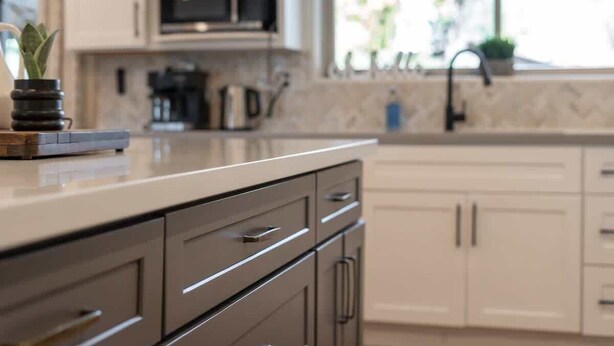 A kitchen with a countertop, cabinets, a sink, and a window with plants. - 5BR/3BA Mountain Retreat: Fun in Flagstaff (Flagstaff)