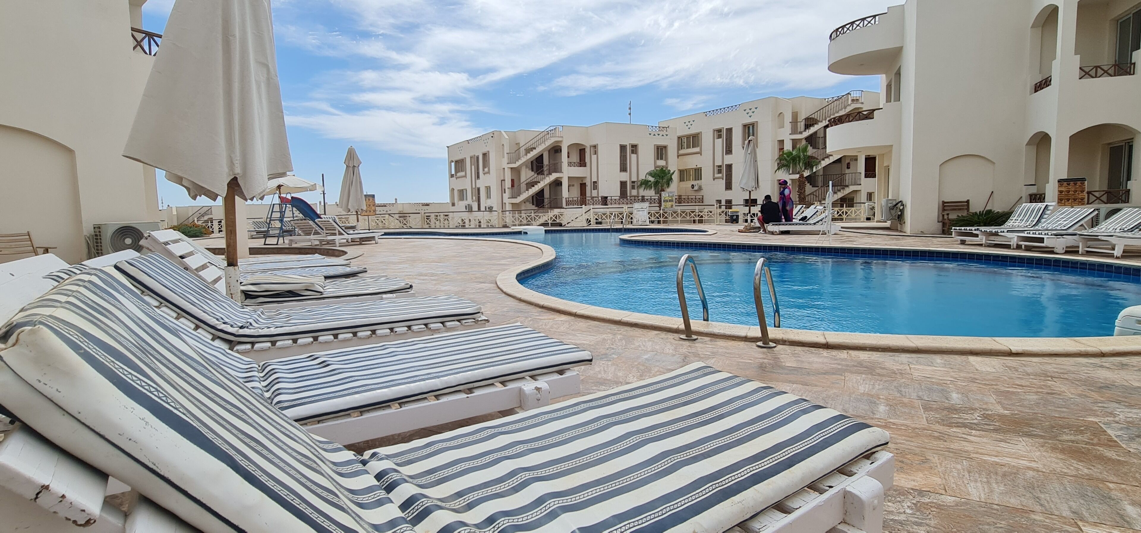 2 outdoor pools, pool umbrellas, pool loungers