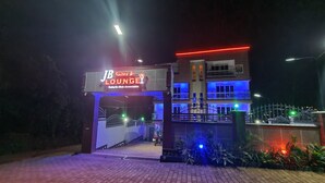 A building with a sign reading "JB Suites & Loungey" indicating a hotel or accommodation. - JB suites and lounge (Kampala)