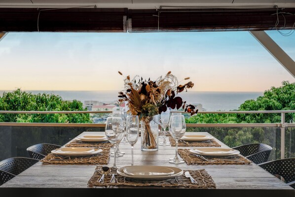 Enjoy al fresco dining on the outdoor terrace with a scenic ocean view.