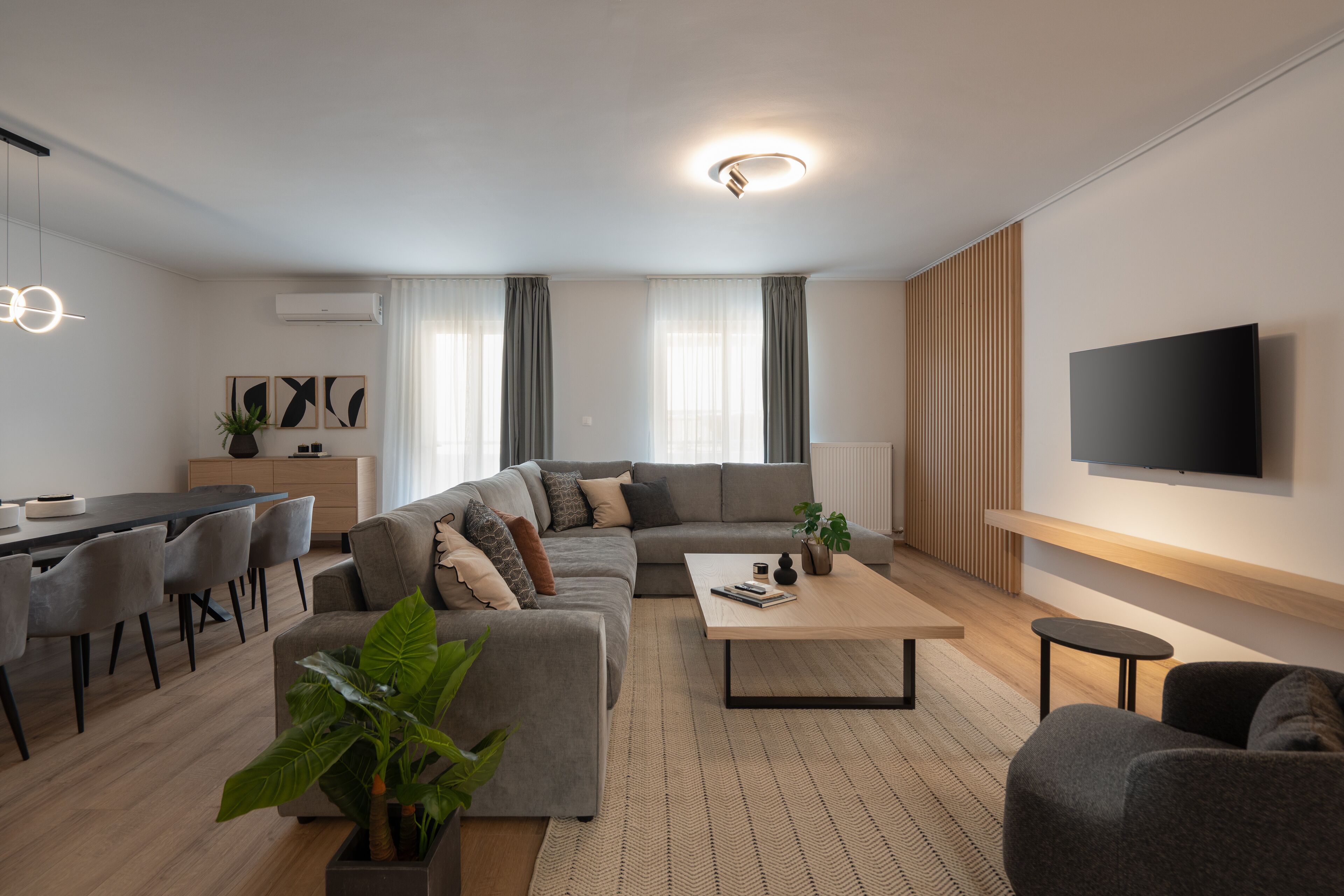 Design Apartment (Athens Hills B) | Living area | 50-inch Smart TV with cable channels