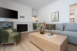 Exclusive Apartment (Athens Hills D) | Living room | 50-inch Smart TV with cable channels