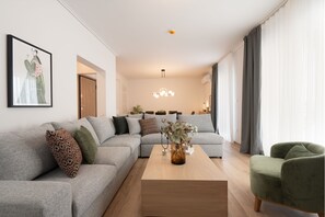 Exclusive Apartment (Athens Hills D) | Living room | 50-inch Smart TV with cable channels