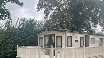 Enjoy a peaceful stay in this cozy home with a balcony and porch area.