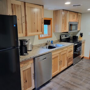 Fridge, microwave, oven, stovetop - Former bar with games, multiple kitchens, 5 bedrooms, sleeps 14.  (Gillett)