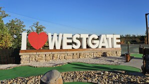 A sign with "I ♥ WESTGATE" in large letters, set against a clear blue sky. - Westgate Resort with beautiful mountain views, Smoky Mountain National Park (Gatlinburg)