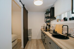 Basic Apartment | Private kitchen | Toaster, eco-friendly cleaning products, dining tables