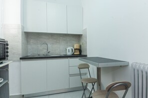 Apartment | Private kitchen | Full-size fridge, oven, toaster, cookware/dishes/utensils