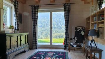 Exclusive Chalet | Living area | 32-inch flat-screen TV with satellite channels