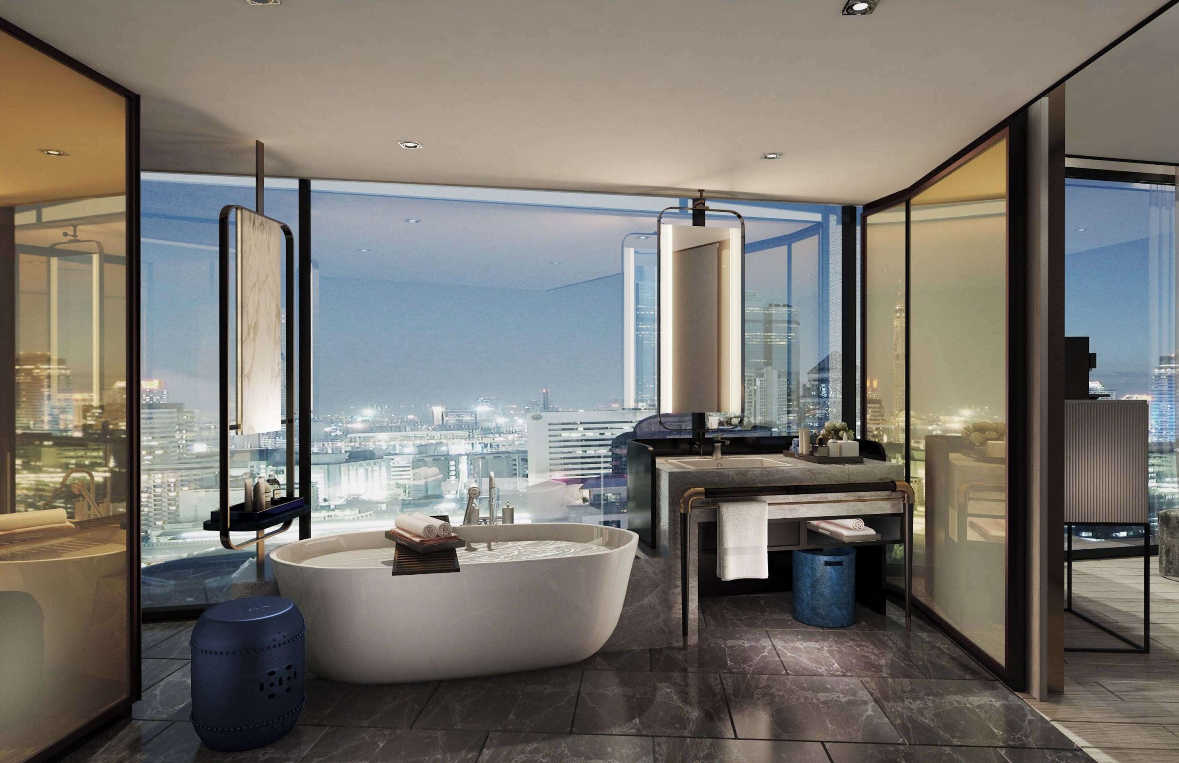 プレミアム ルーム キングベッド 1 台 リバービュー | バスルーム | 個別の浴槽とシャワー、ヘアドライヤー、バスローブ、スリッパ