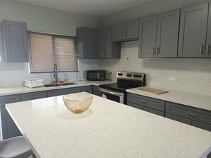 Fridge, microwave, oven, stovetop - Large Family 2 bedroom 2 bathroom apartment in Ironshore. Kitchen. Pool, lounge (Montego Bay)