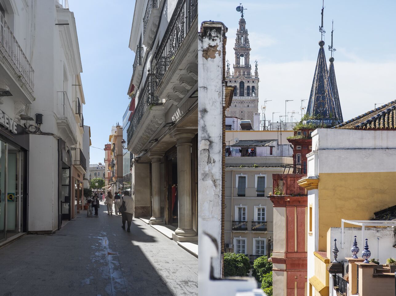 A narrow street with historic buildings, including a prominent church with a bell tower and spires.