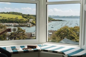 A bay view from a window with a view of boats and a green landscape. - Frobisher Apartments (Falmouth)