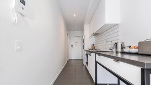 Private kitchen - Cityscape Comforts A Stylish Southbank Retreat (Melbourne)